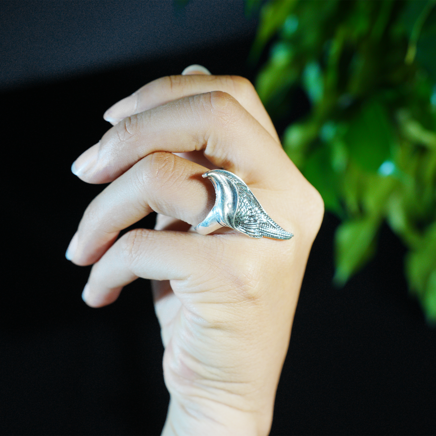 Wing shaped gothic ring with dynamic curves, feathered statement band, mystical guardian style, ideal for bold outfits & symbolic styling