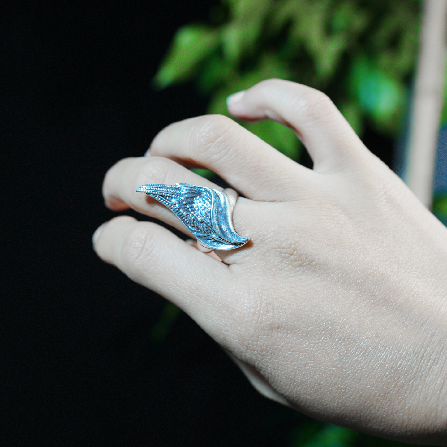 Wing shaped gothic ring with dynamic curves, feathered statement band, mystical guardian style, ideal for bold outfits & symbolic styling