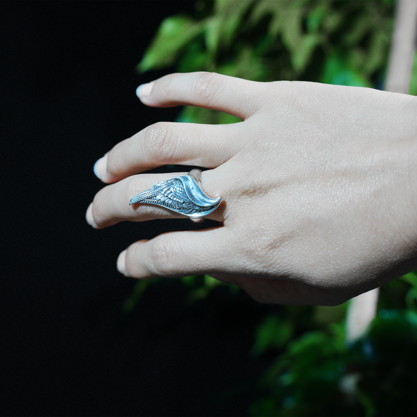 Wing shaped gothic ring with dynamic curves, feathered statement band, mystical guardian style, ideal for bold outfits & symbolic styling