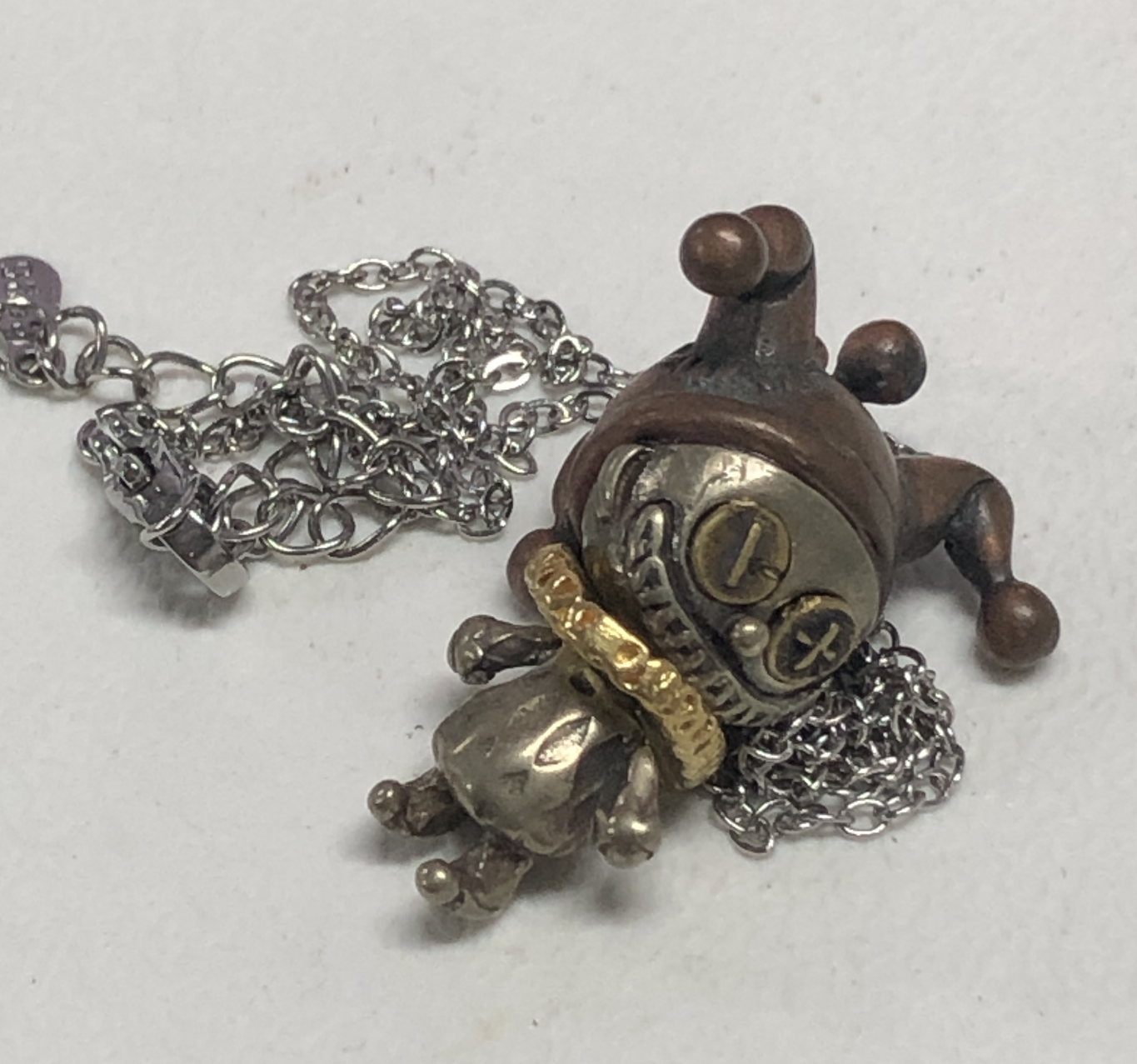 Broken Smile Jester Pendant Necklace – Gothic Copper Doll Clown Charm with Dark Fantasy Style