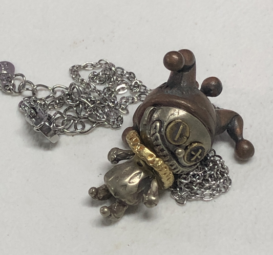 Broken Smile Jester Pendant Necklace – Gothic Copper Doll Clown Charm with Dark Fantasy Style