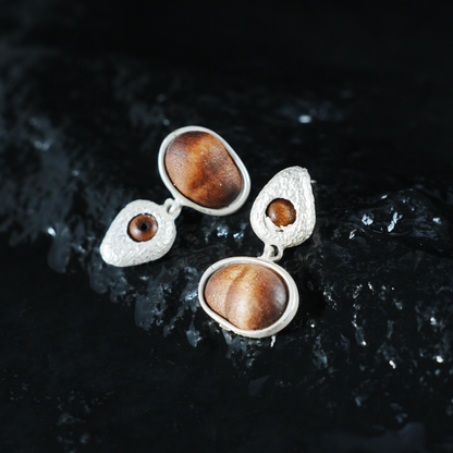 Eye of the Seed – Abstract Cat Eye Earrings with Wood-Style Gem & Textured Frame